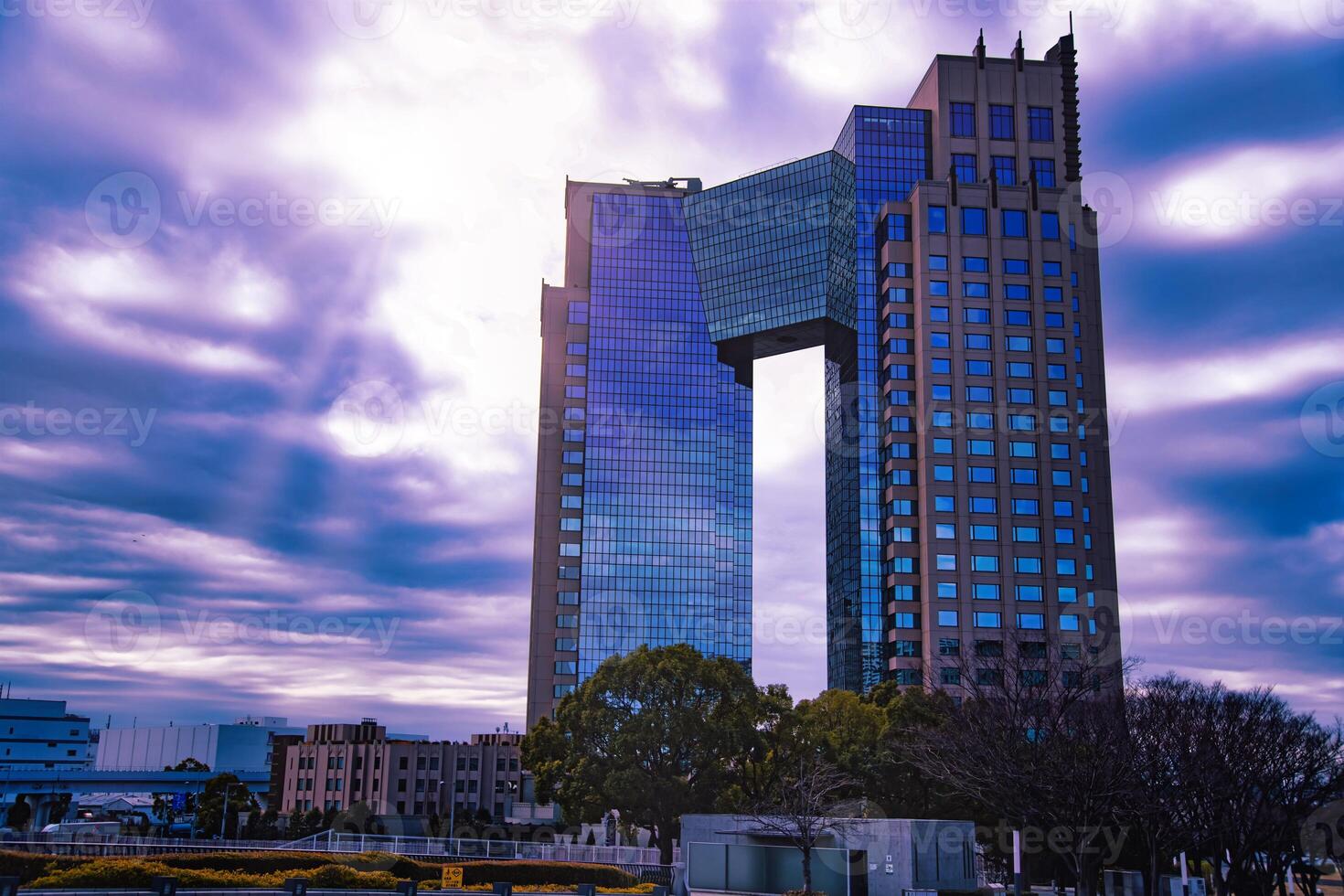 A dusk of cloud reflecting an impressive building cloudy photo