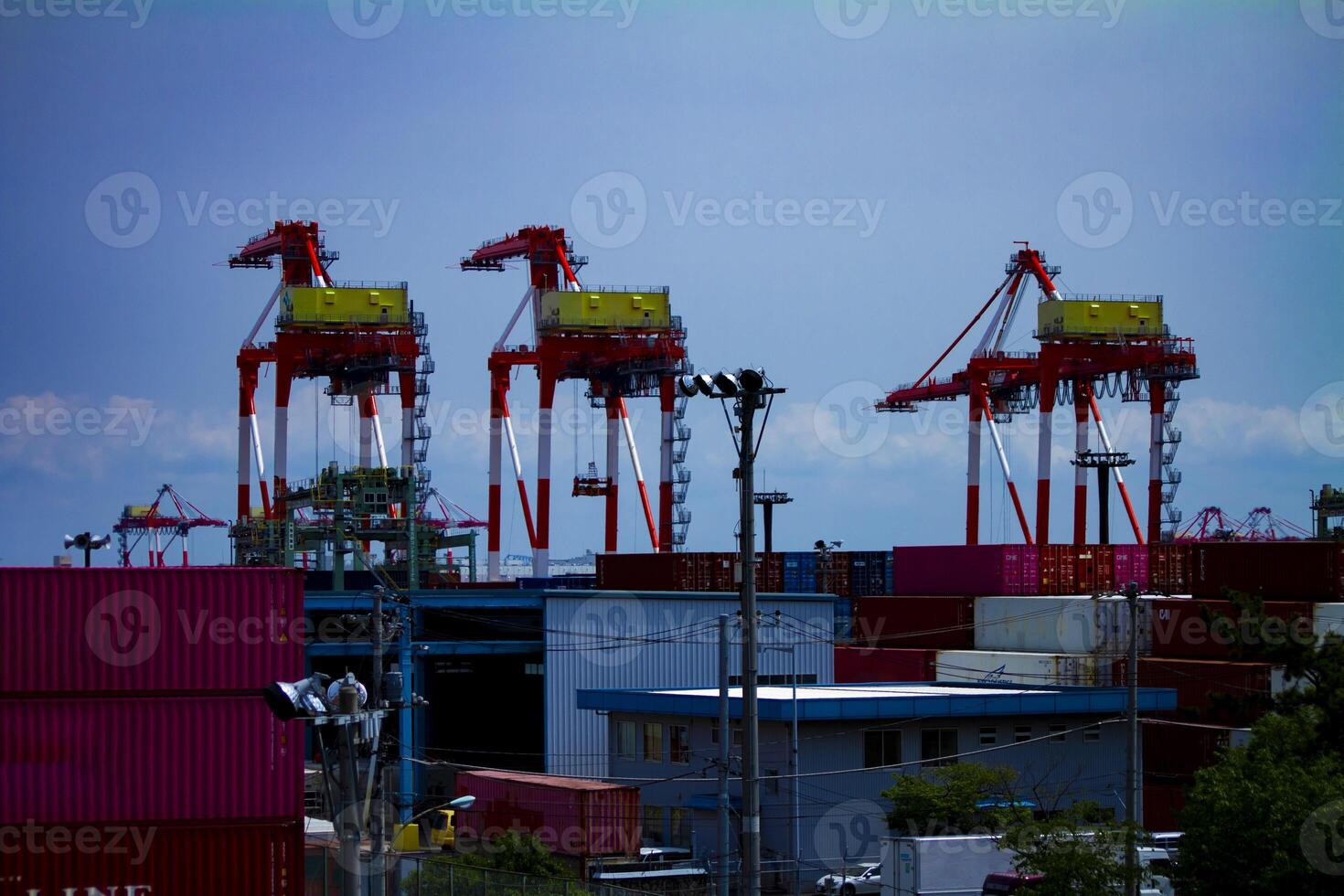 Moving cranes near the warehouse in Tokyo long shot photo