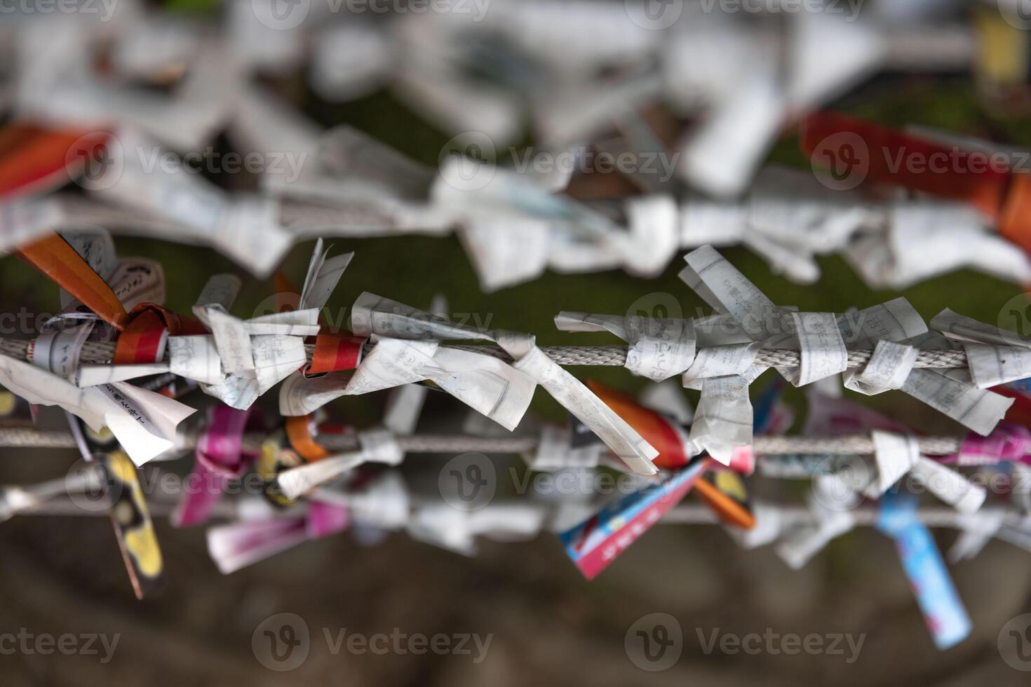 A fortune telling slip at Tomioka Shrine closeup photo