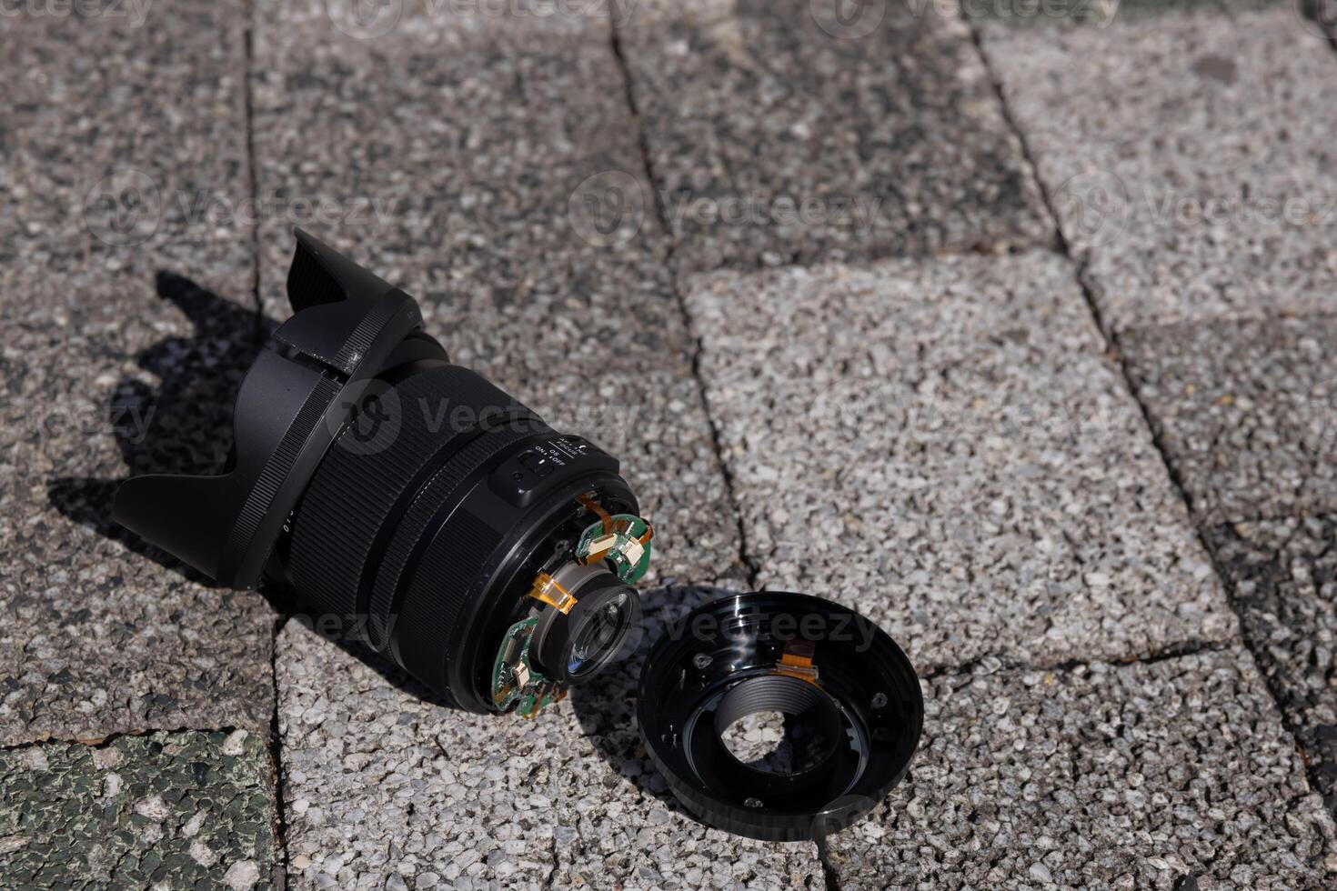 A broken lens on the street sunny day handheld photo