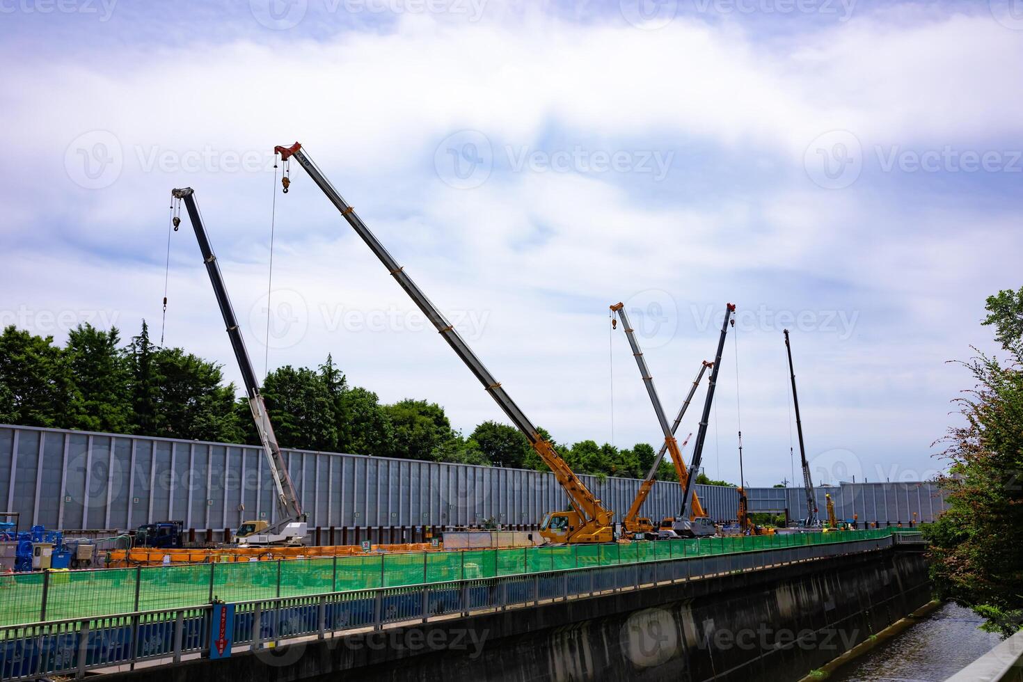 Cranes at the under construction in Tokyo wide shot photo