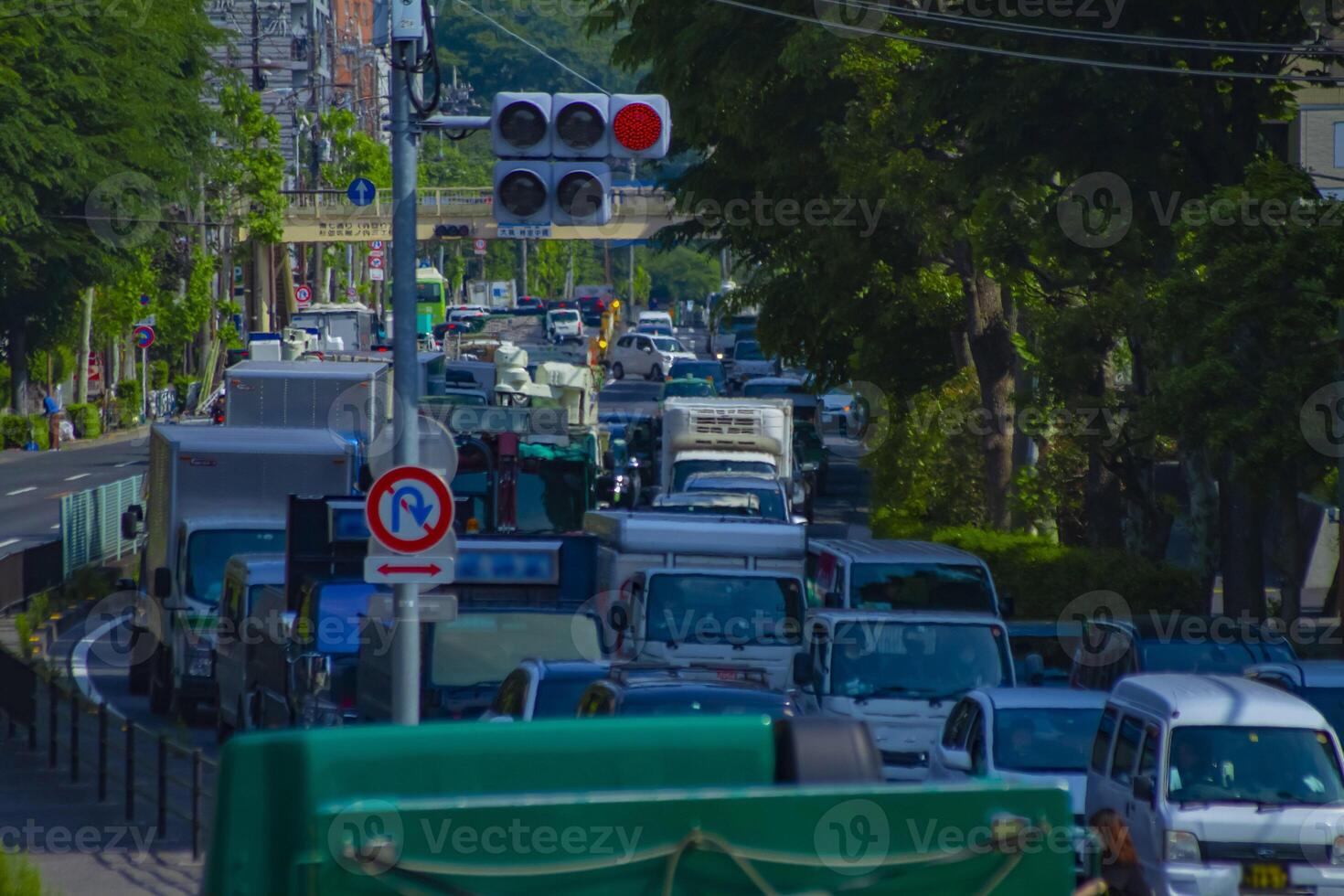 A traffic jam at the urban street in Tokyo long shot photo