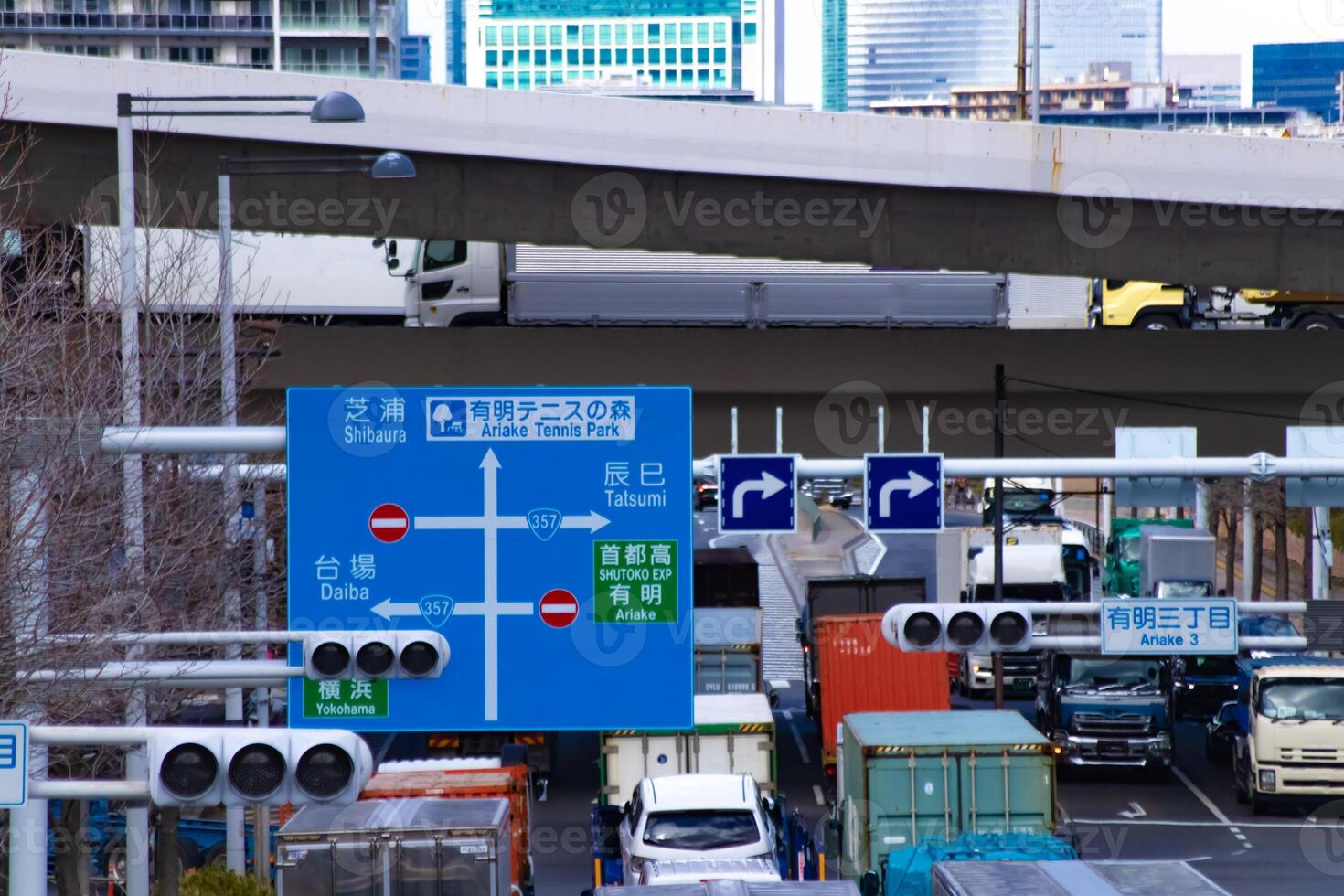 A traffic jam at the city street near the highway in Tokyo telephoto shot photo