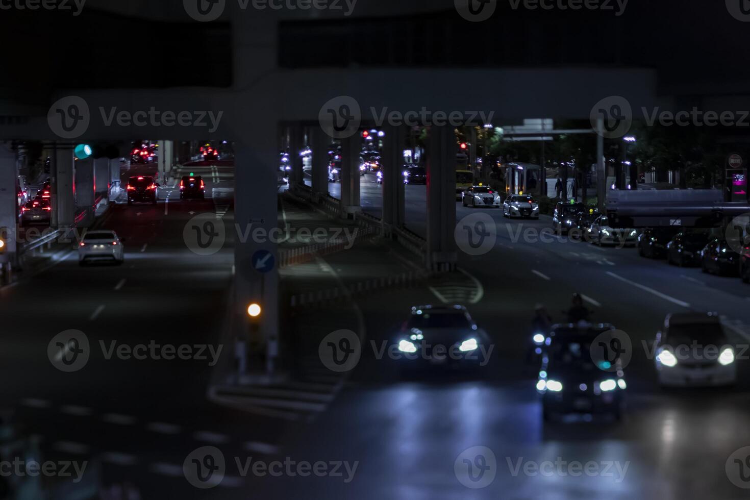 A night miniature traffic jam at the urban street in Tokyo photo