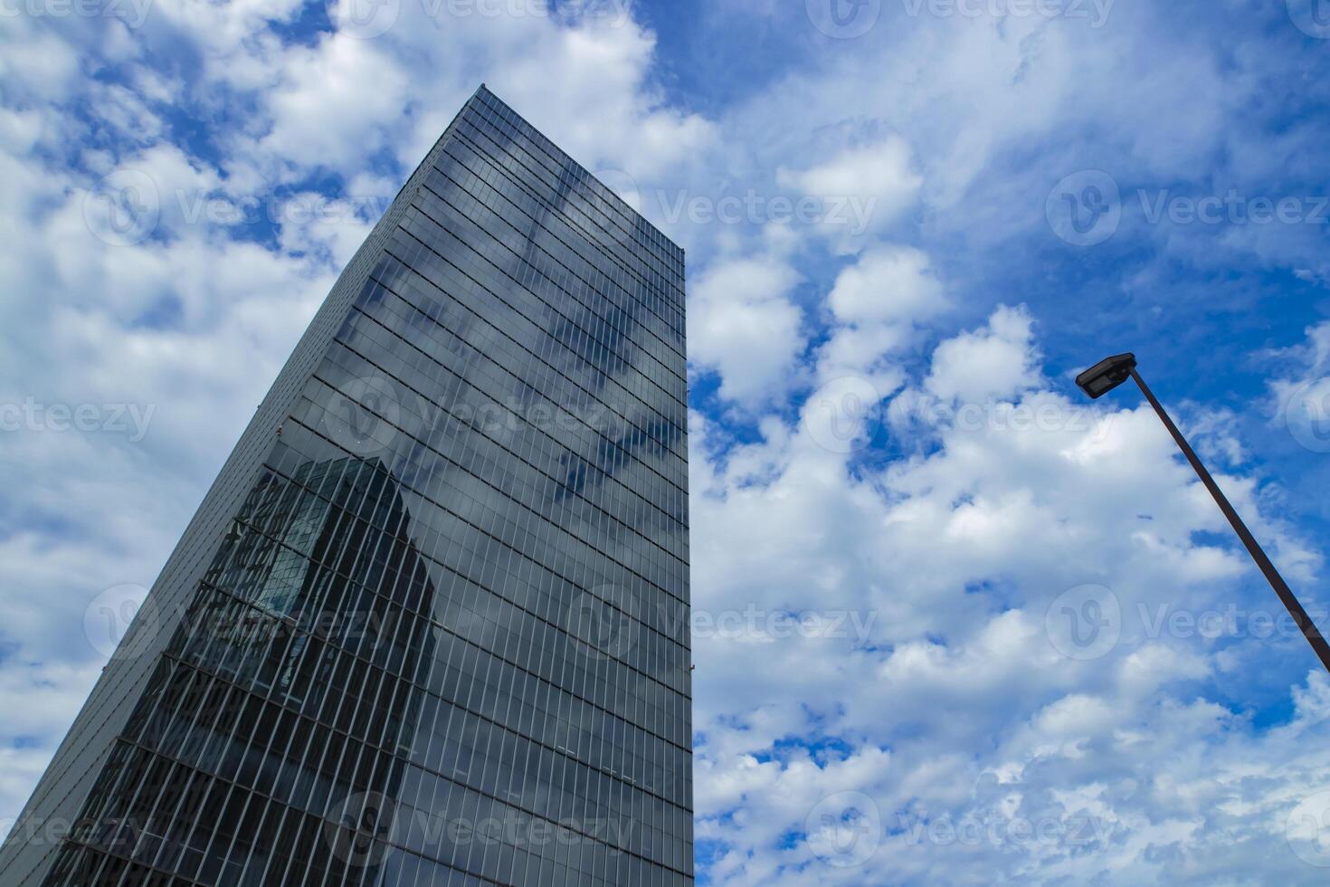 A cloud reflecting the building in the business town wide shot photo