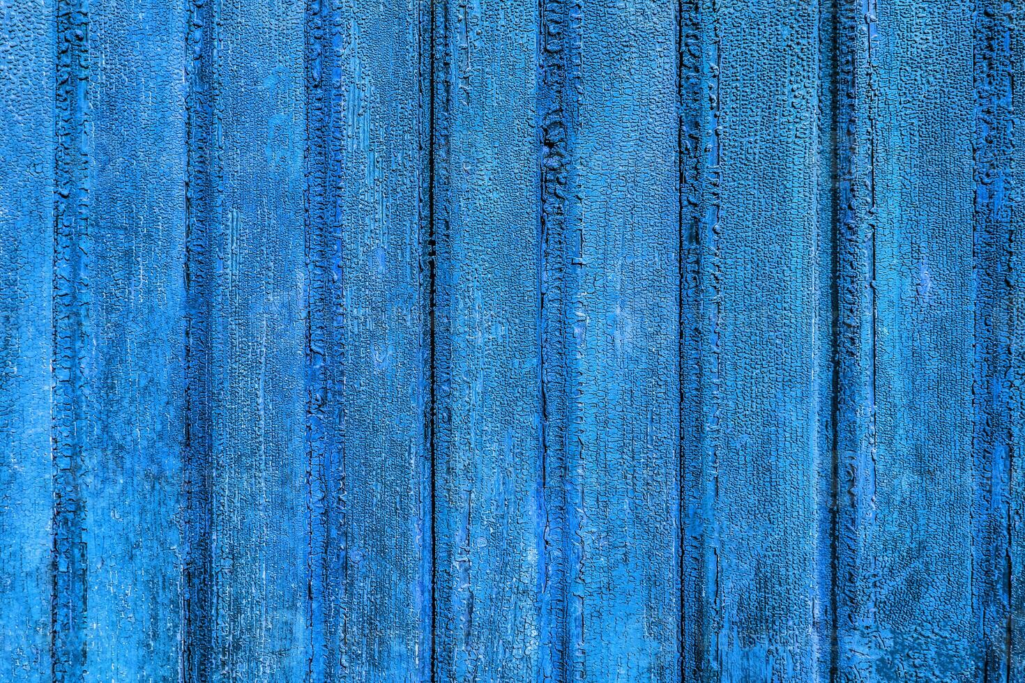 the texture of wooden boards with remnants of paint photo