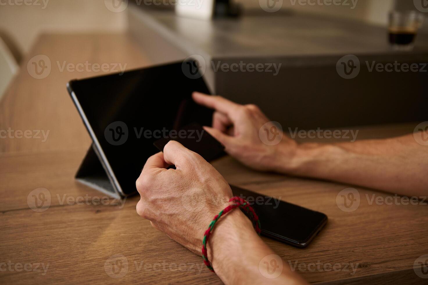 Hands using digital tablet for online shopping, receiving or making payments via internet mobile banking application photo