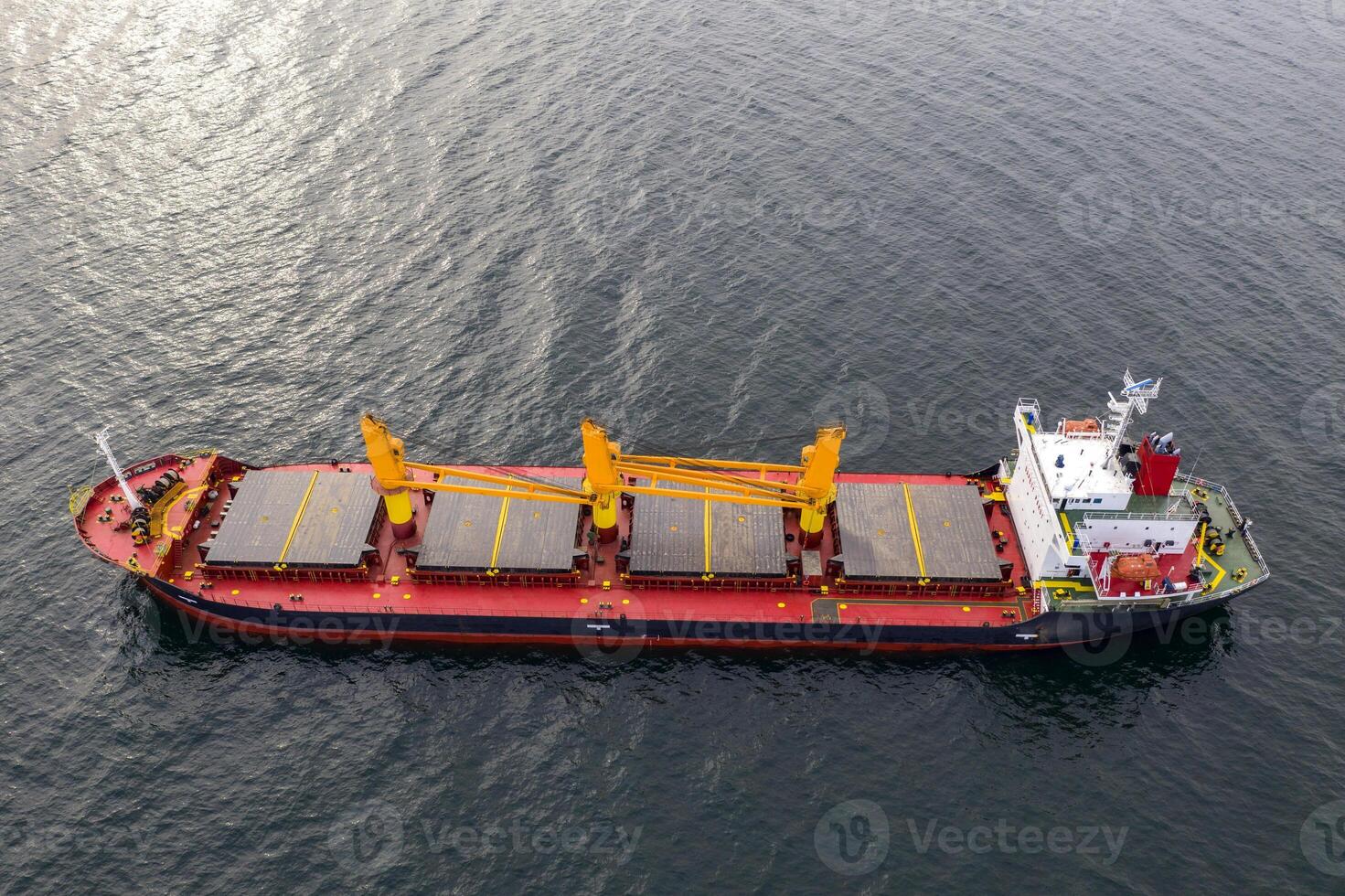 Large ship at sea. Aerial top view of cargo ship vessel import export sailing. photo