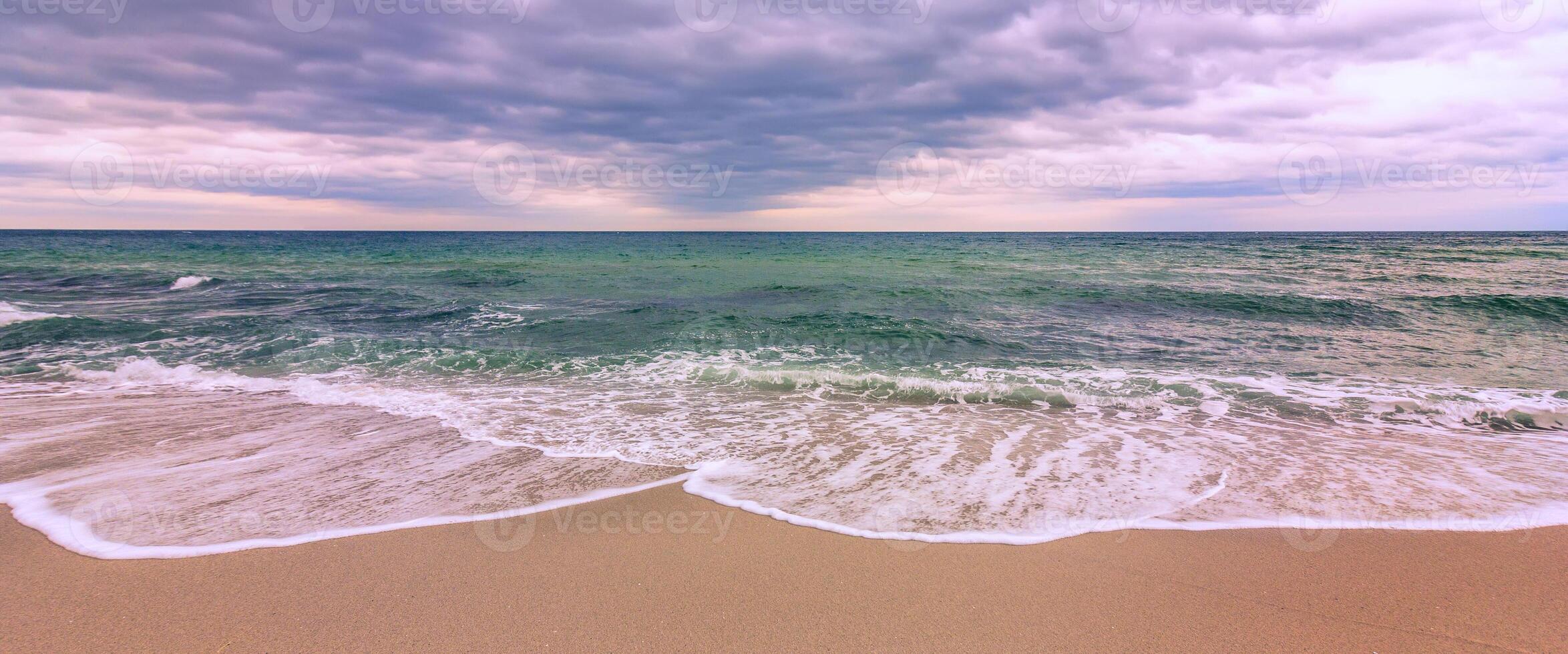 Beautiful pastel panoramic view of the sea. Wave pattern photo