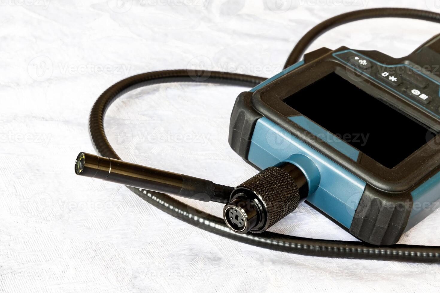 Endoscope camera on the table. Flexible inspection camera photo