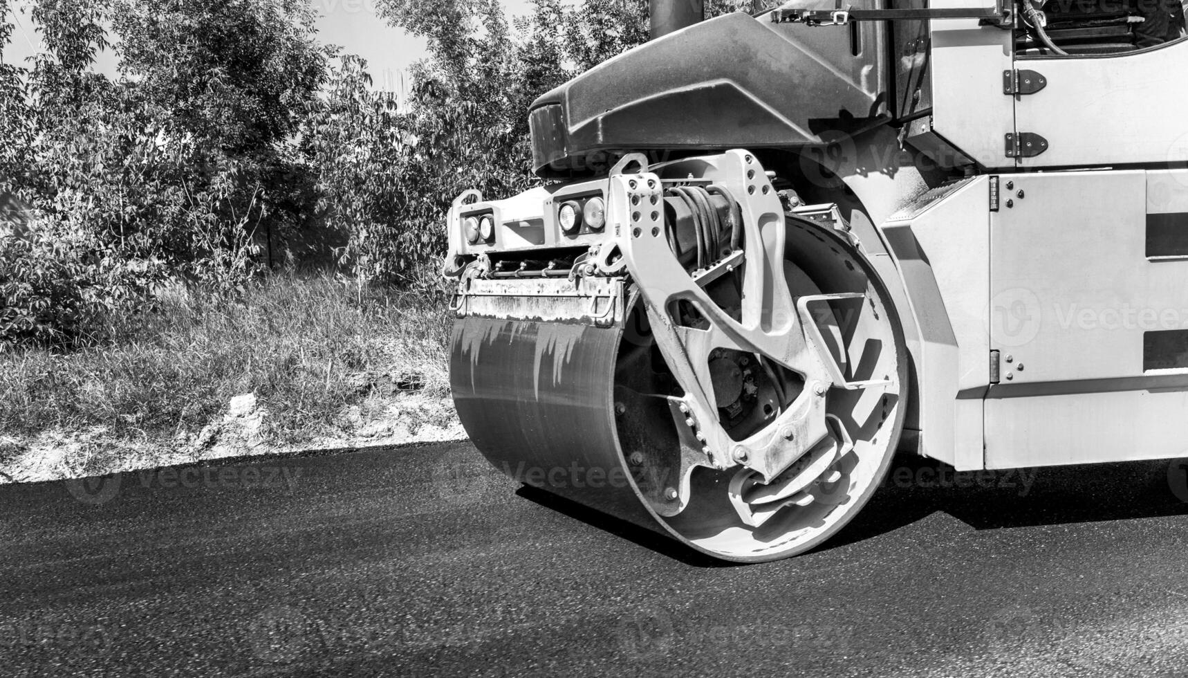 Close view of drum roller at the construction site, working on the new road photo