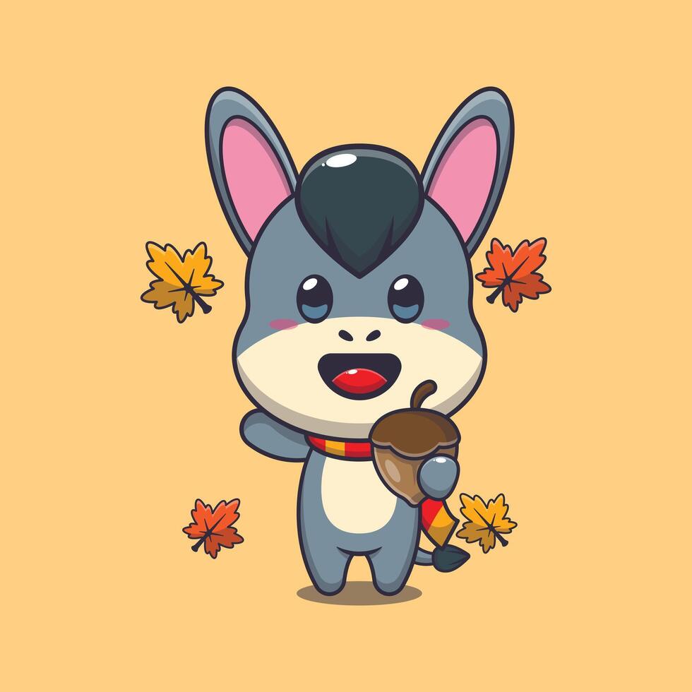Cute donkey with acorns at autumn season. Mascot cartoon vector illustration suitable for poster, brochure, web, mascot, sticker, logo and icon.