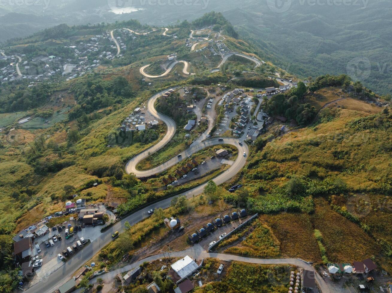 An aerial perspective showcases the intricate network of winding roads meandering through the hilly landscape at the break of dawn photo