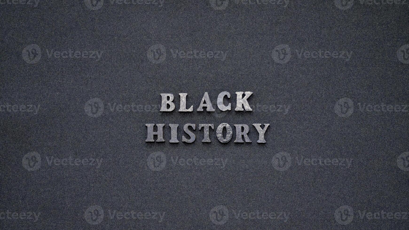 Inscription text Black History Month on dark isolated background close up. Celebrating the African American Conceptual Holiday for Equality photo