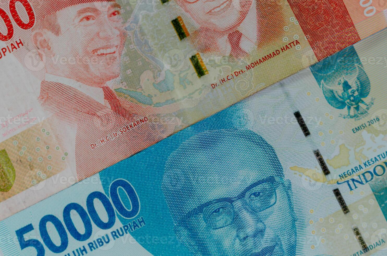 Close-up background of Indonesian currency, 100,000 and 50,000 rupiah. photo