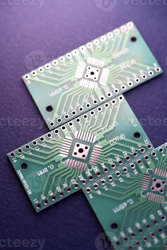 Green printed circuit boards for soldering radio components.  A set for a beginner amateur radio operator. photo