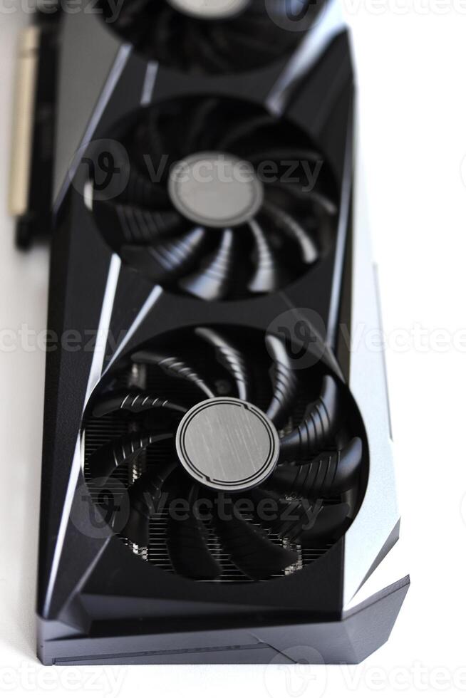 A black and white video card on a white background. Fans and the graphics card case. Computer accessories. photo