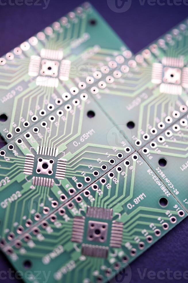 Green printed circuit boards for soldering radio components.  A set for a beginner amateur radio operator. photo