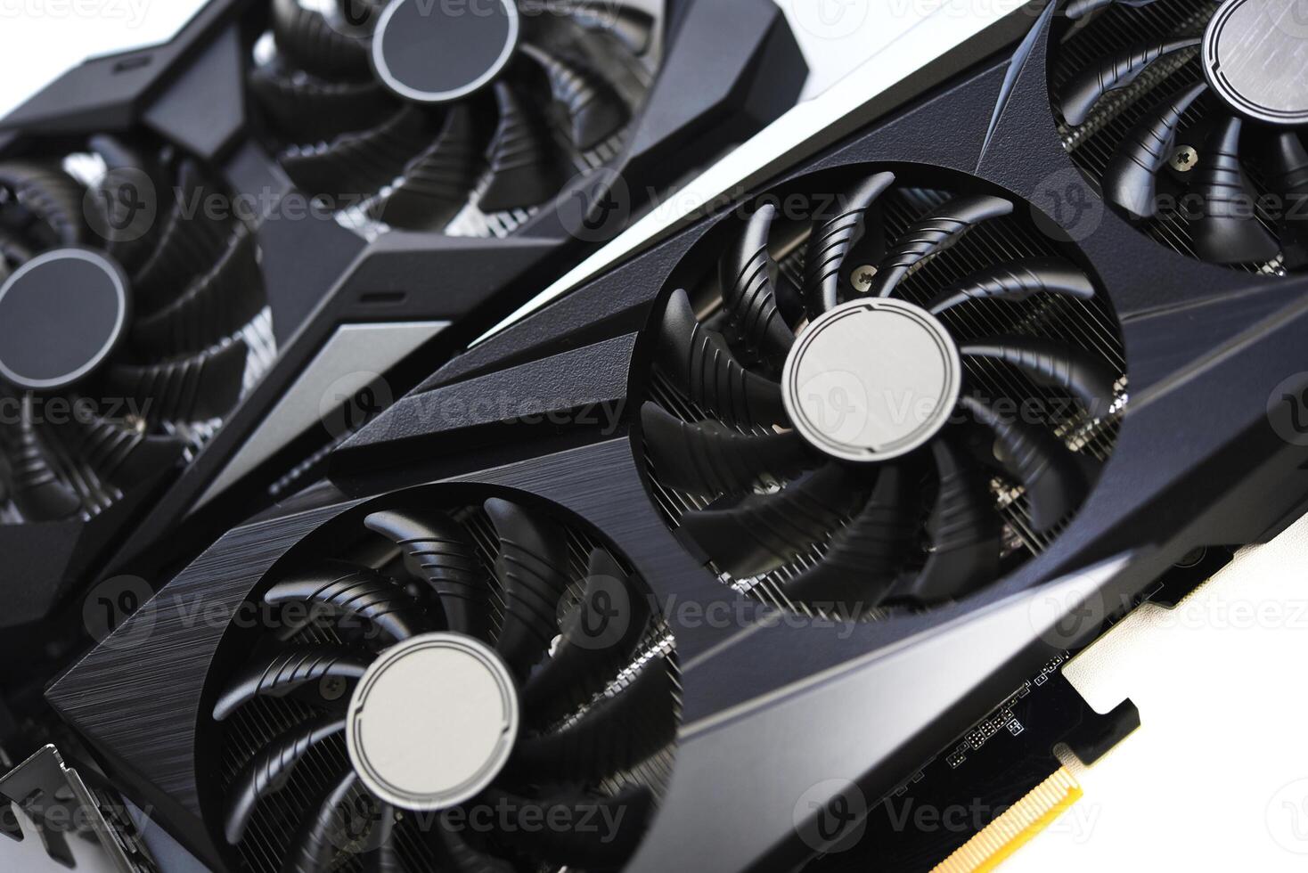 A black and white video card on a white background. Fans and the graphics card case. Computer accessories. photo