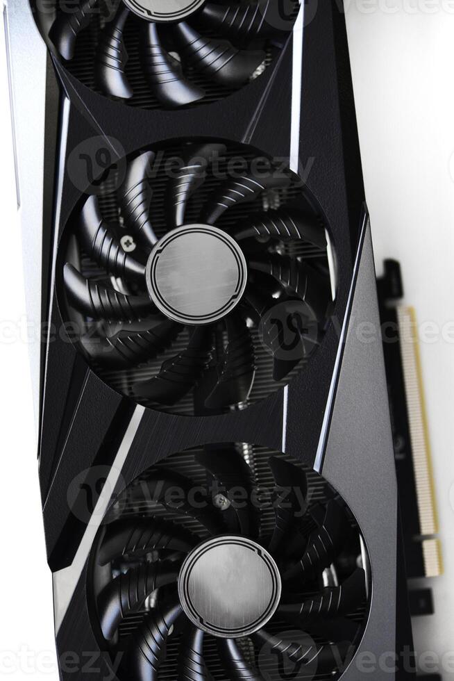 A black and white video card on a white background. Fans and the graphics card case. Computer accessories. photo