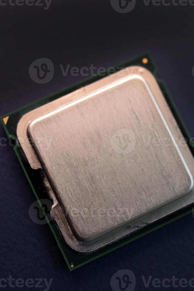 The shiny cover of the computer processor. Multiple processors on a blue background. Computer details. photo