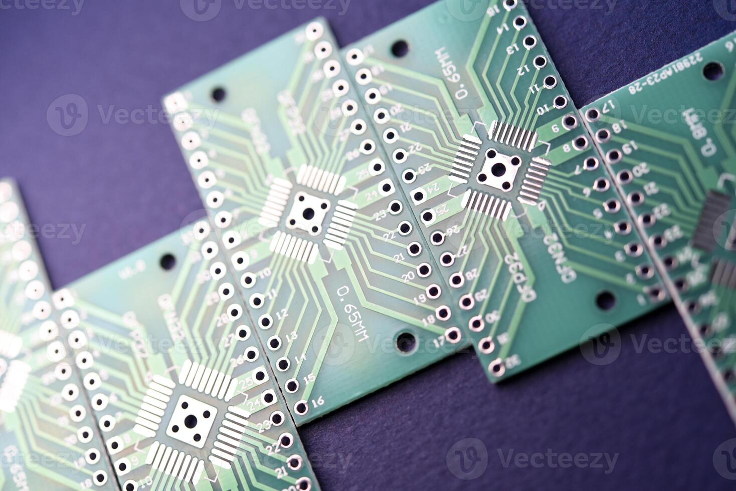 Green printed circuit boards for soldering radio components.  A set for a beginner amateur radio operator. photo