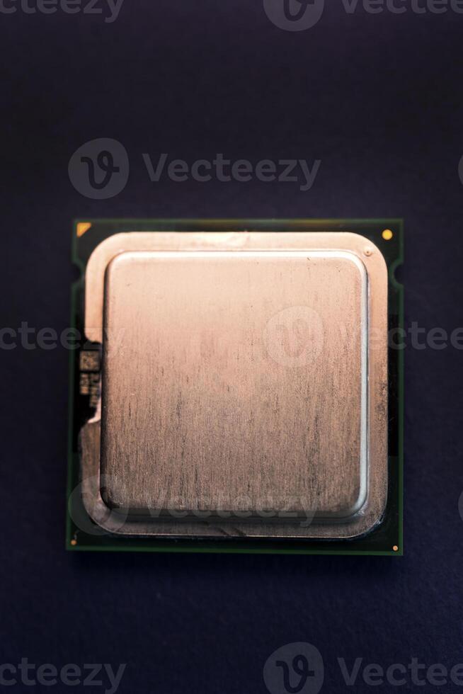 The shiny cover of the computer processor. Multiple processors on a blue background. Computer details. photo