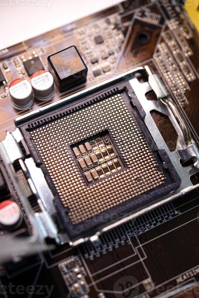 Microprocessor and socket on the motherboard. Computer radio components. Microchips and chips. photo