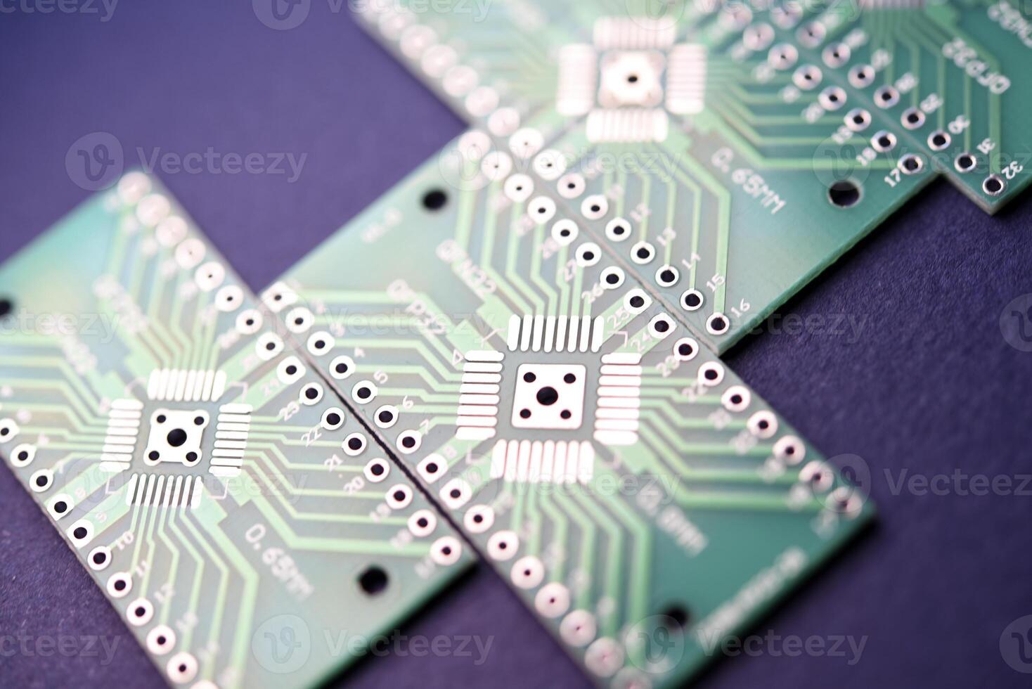 Green printed circuit boards for soldering radio components.  A set for a beginner amateur radio operator. photo