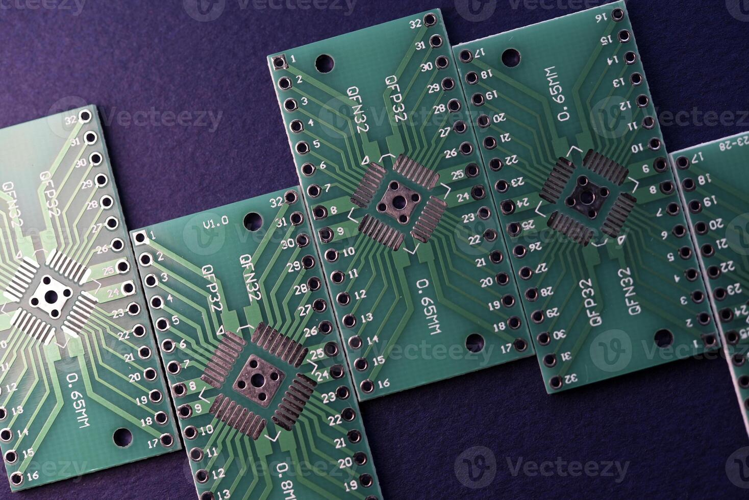 Green printed circuit boards for soldering radio components.  A set for a beginner amateur radio operator. photo