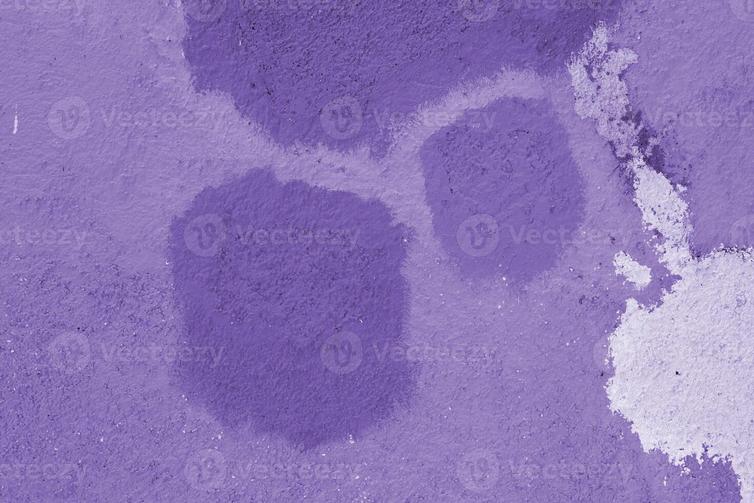 Texture of old house concrete wall painted into lilac, shades of purple, violet color with spots and cracks on the surface. Decorative plaster. Abstract design grunge background. Copy space photo