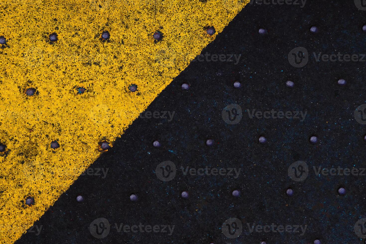 Grunge steel industrial boat floor plate painted yellow black anti-rust paint. Robust ferry ship metal pattern. Old dotted iron deck. Worn metal texture background. Modern design concept. Copy space photo