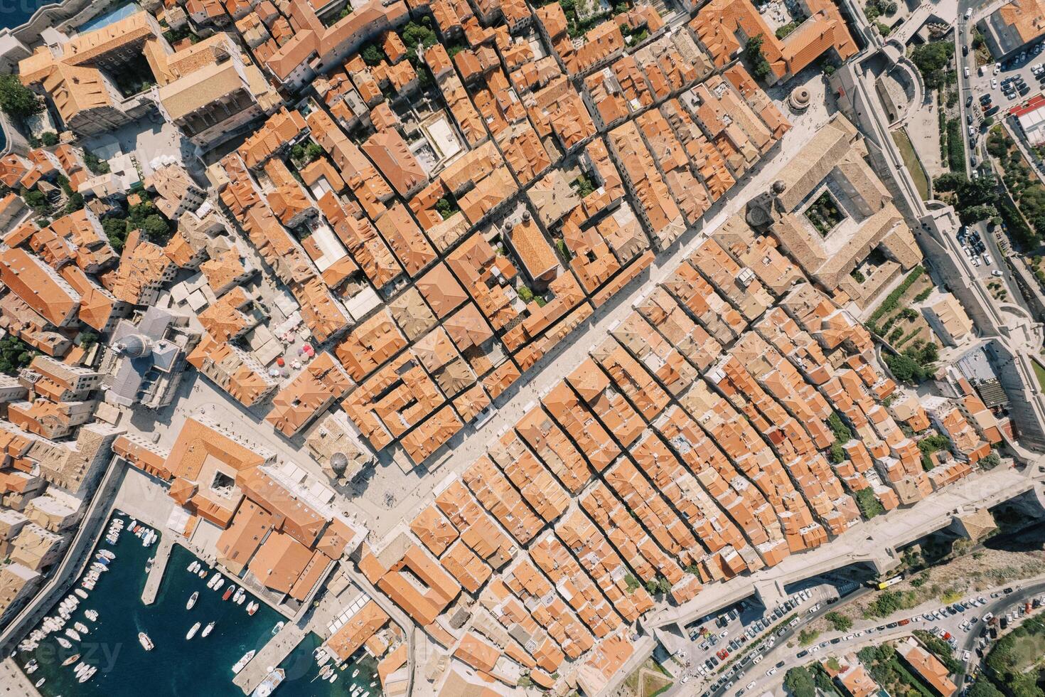Red roofs of ancient houses in the port. Dubrovnik, Croatia. Drone photo