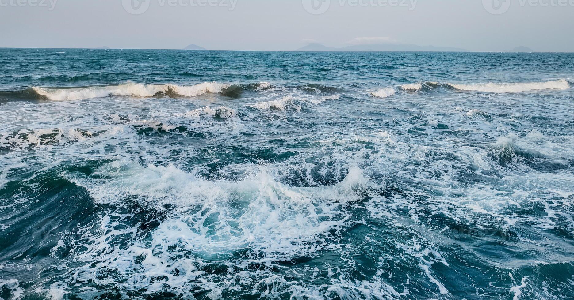 Boundless Ocean Waves Under Pristine Sky photo