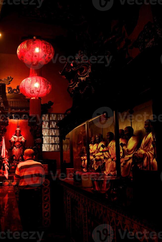 The atmosphere of worship at the temple during the Chinese New Year celebration photo