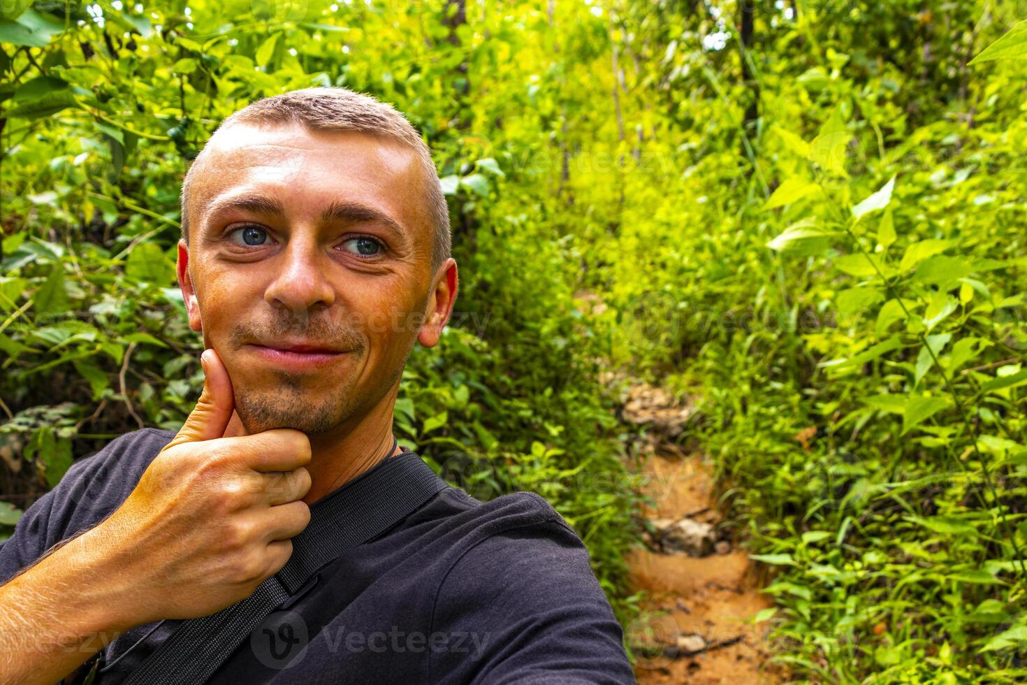 Man tourist Tropical jungle forest hiking trails Chiang Mai Thailand. photo