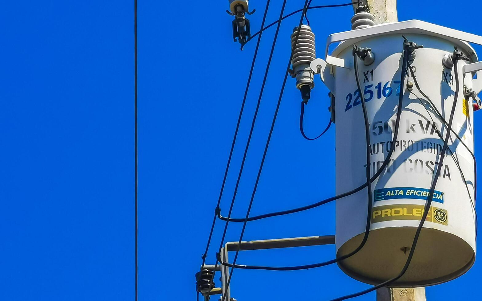 Puerto Escondido Oaxaca Mexico 2022 Power pole cable box with blue sky in Mexico. photo