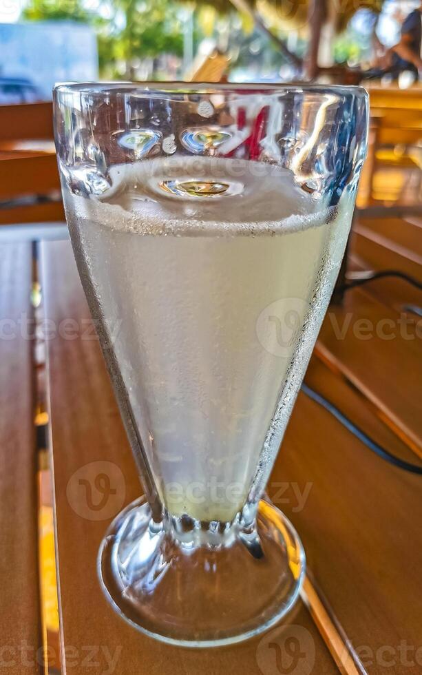 Glass with lime mint and ginger juice in Mexico. photo