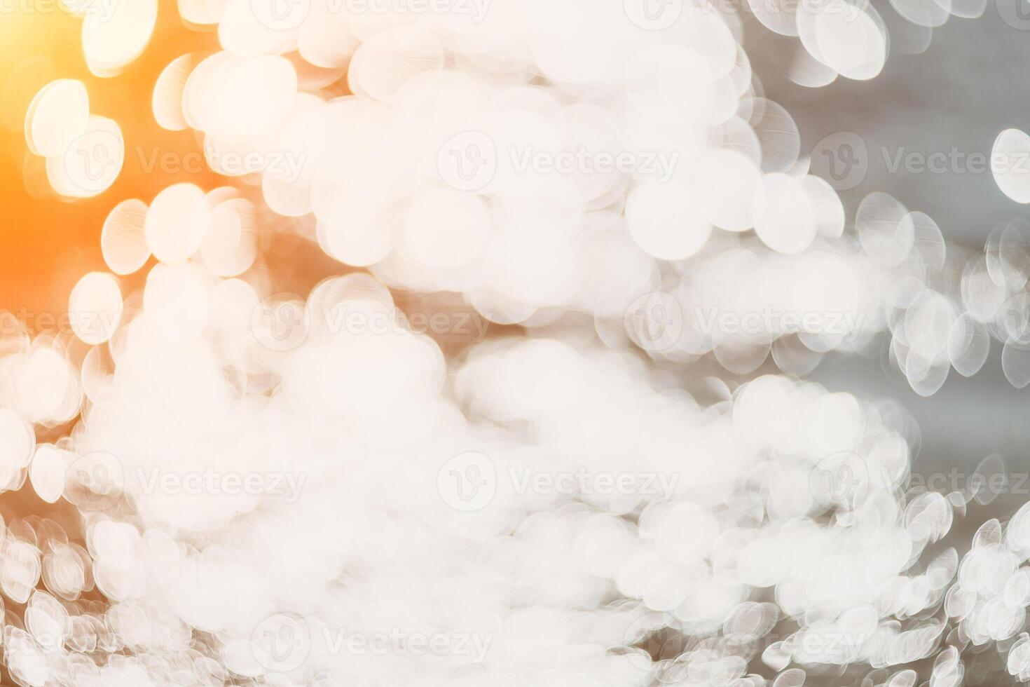 Blurred golden sea at sunset. The sun reflects and sparkles on the waves with bokeh, illuminating the golden sea. Holiday recreation concept. Abstract nautical summer ocean sunset nature background. photo