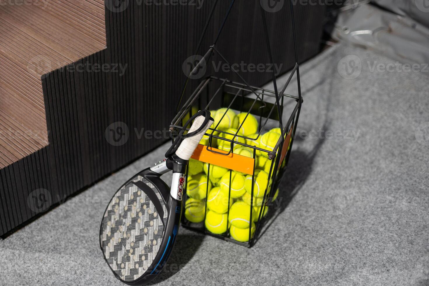 paddle tennis objects in court, racket and balls photo