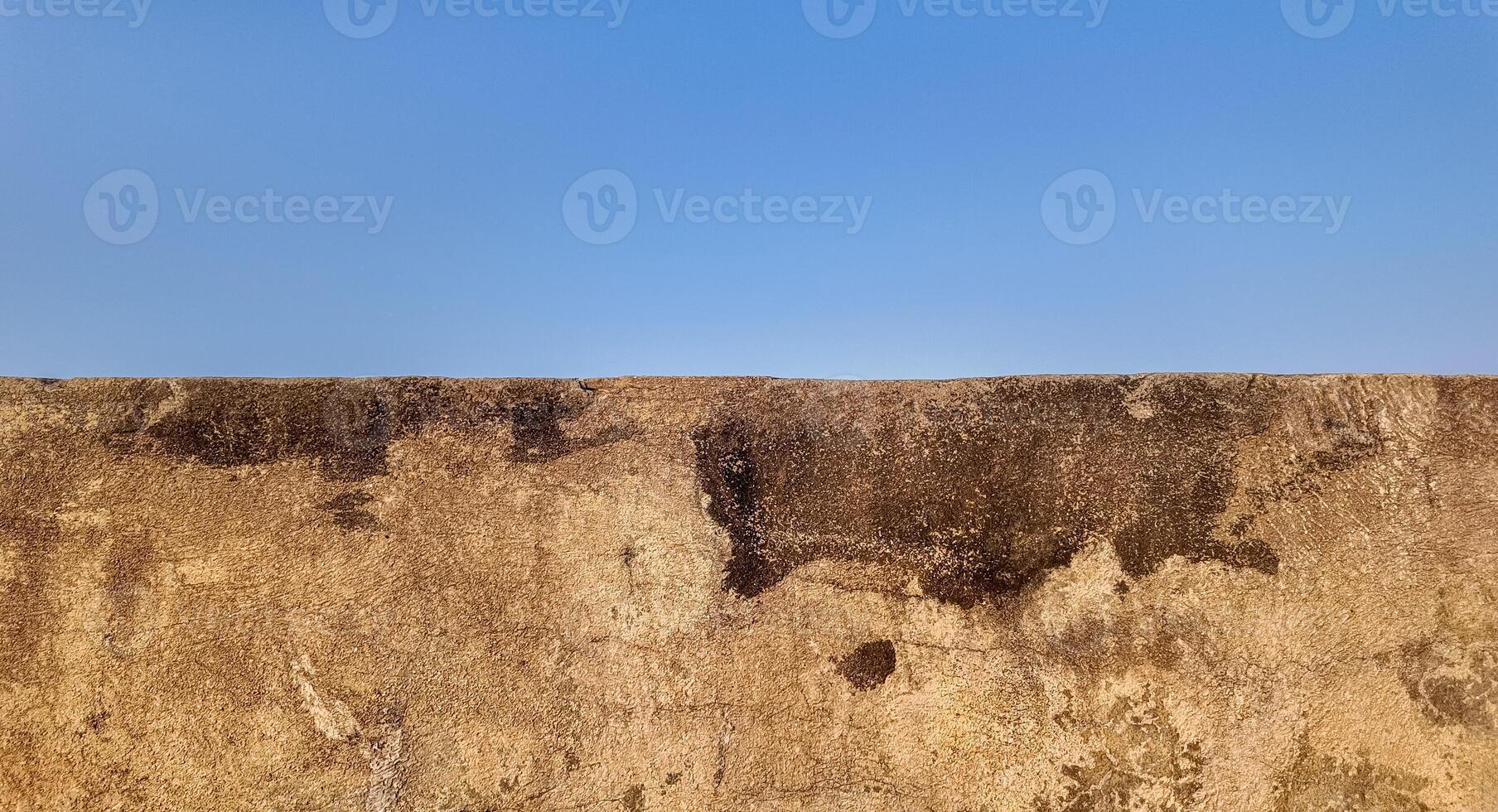 Ancient Wall Texture Under Beautiful Blue Sky photo
