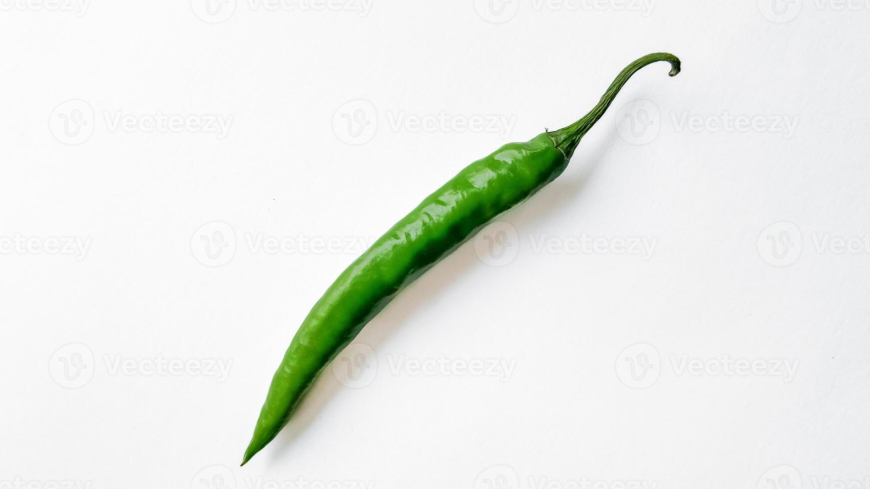 Vibrant Green Chili Pepper on White Background photo