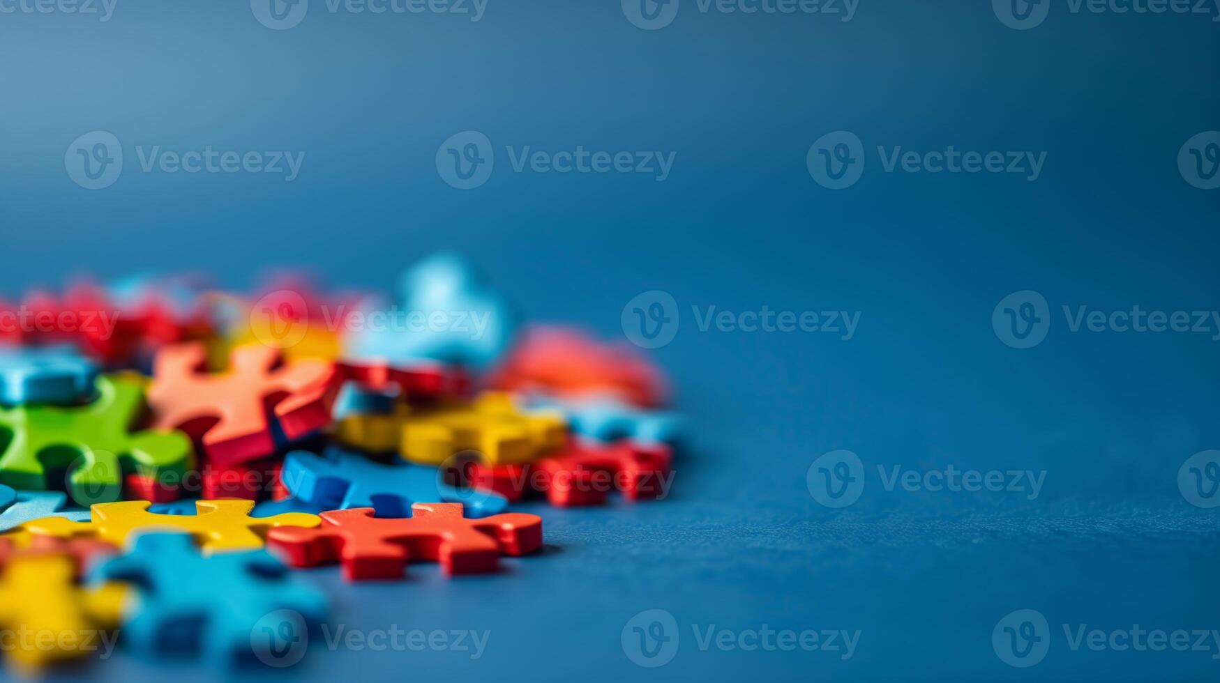 AI generated Vibrant multicolored jigsaw puzzle pieces scattered on a blue background, concept of problem solving and teamwork, with a shallow depth of field and copy space photo