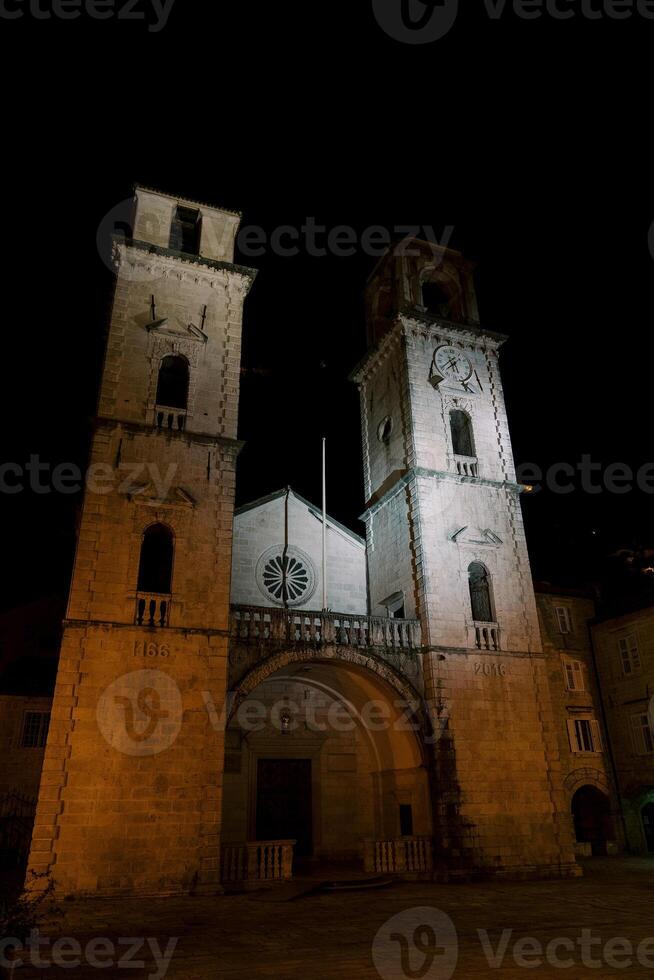 Ancient Cathedral of St. Tryphon at night by the light of lanterns. Kotor, Montenegro photo