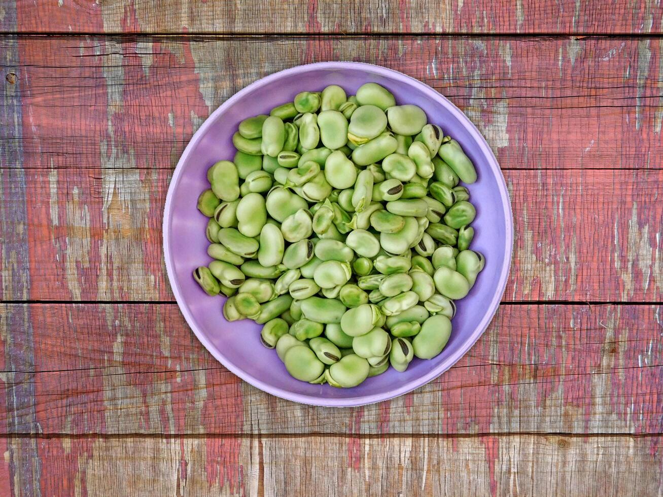 Broad Beans On Wooden Background photo
