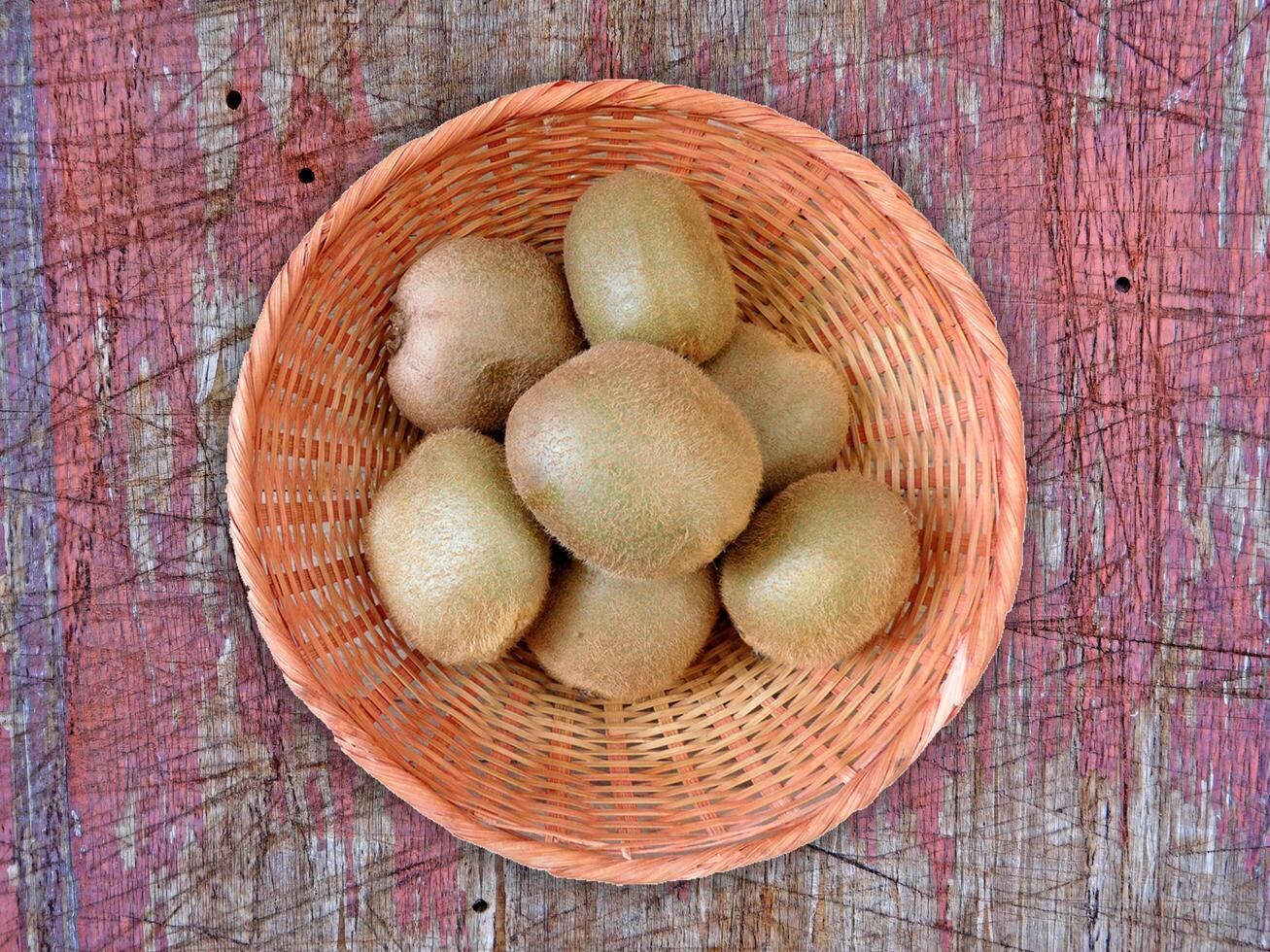 Kiwi On Wooden Background photo