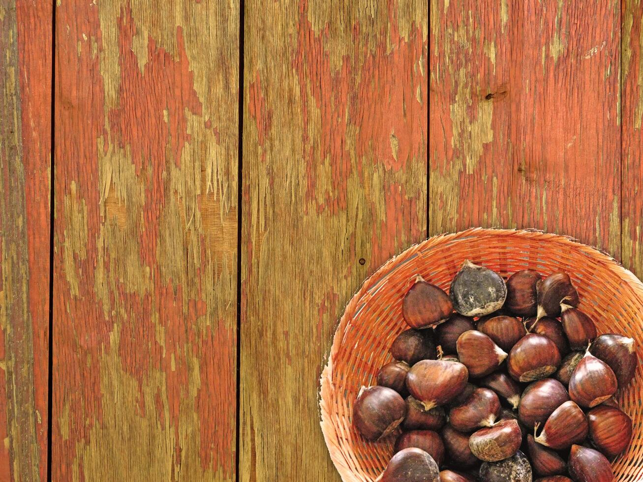 Chestnuts On The Wooden Background photo