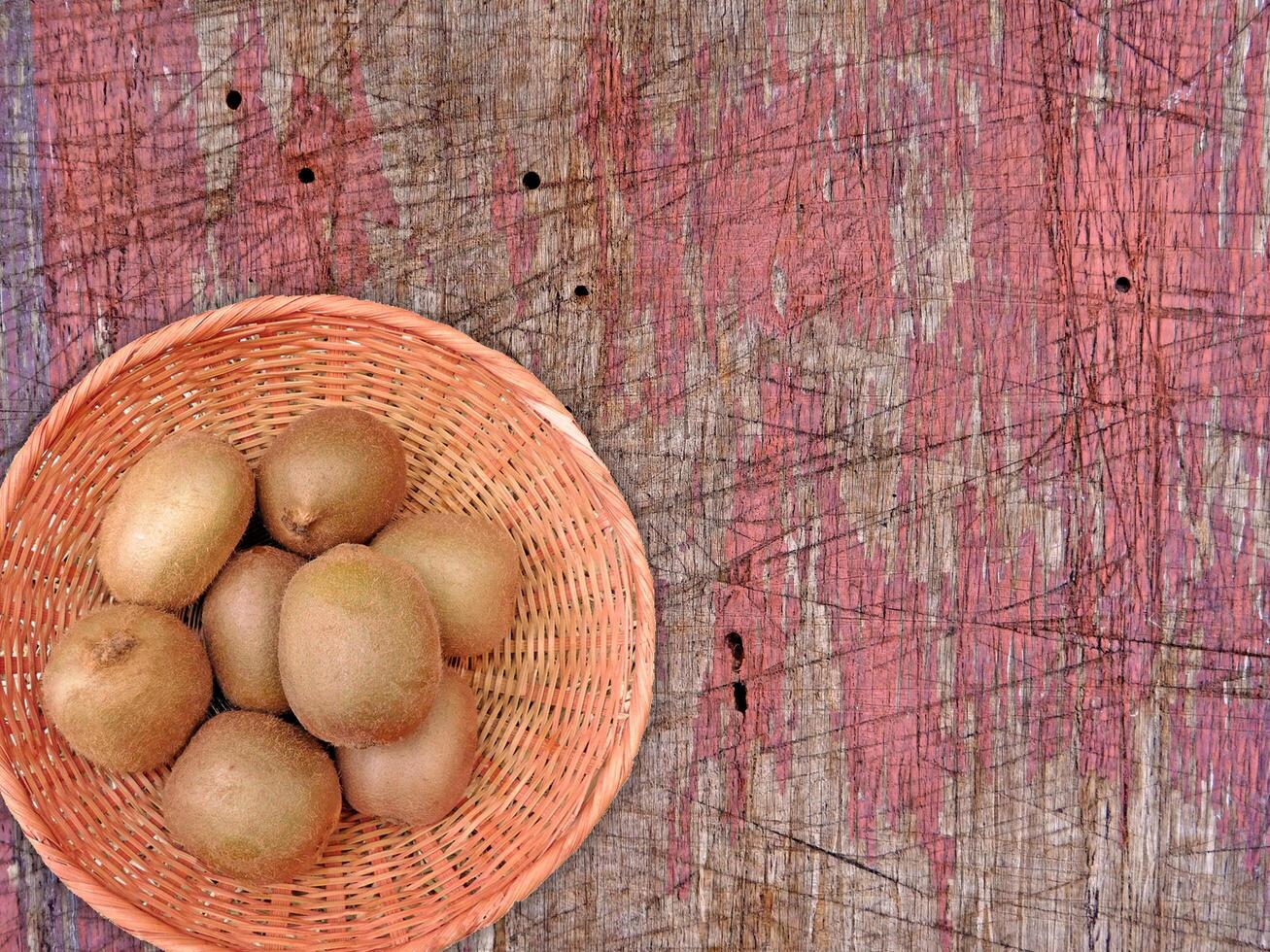 Kiwi On Wooden Background photo