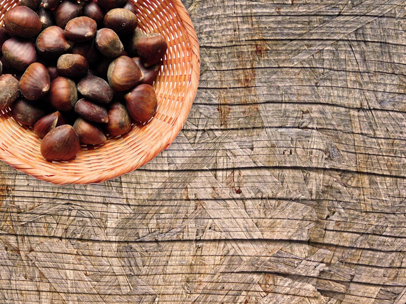 Chestnuts On The Wooden Background photo