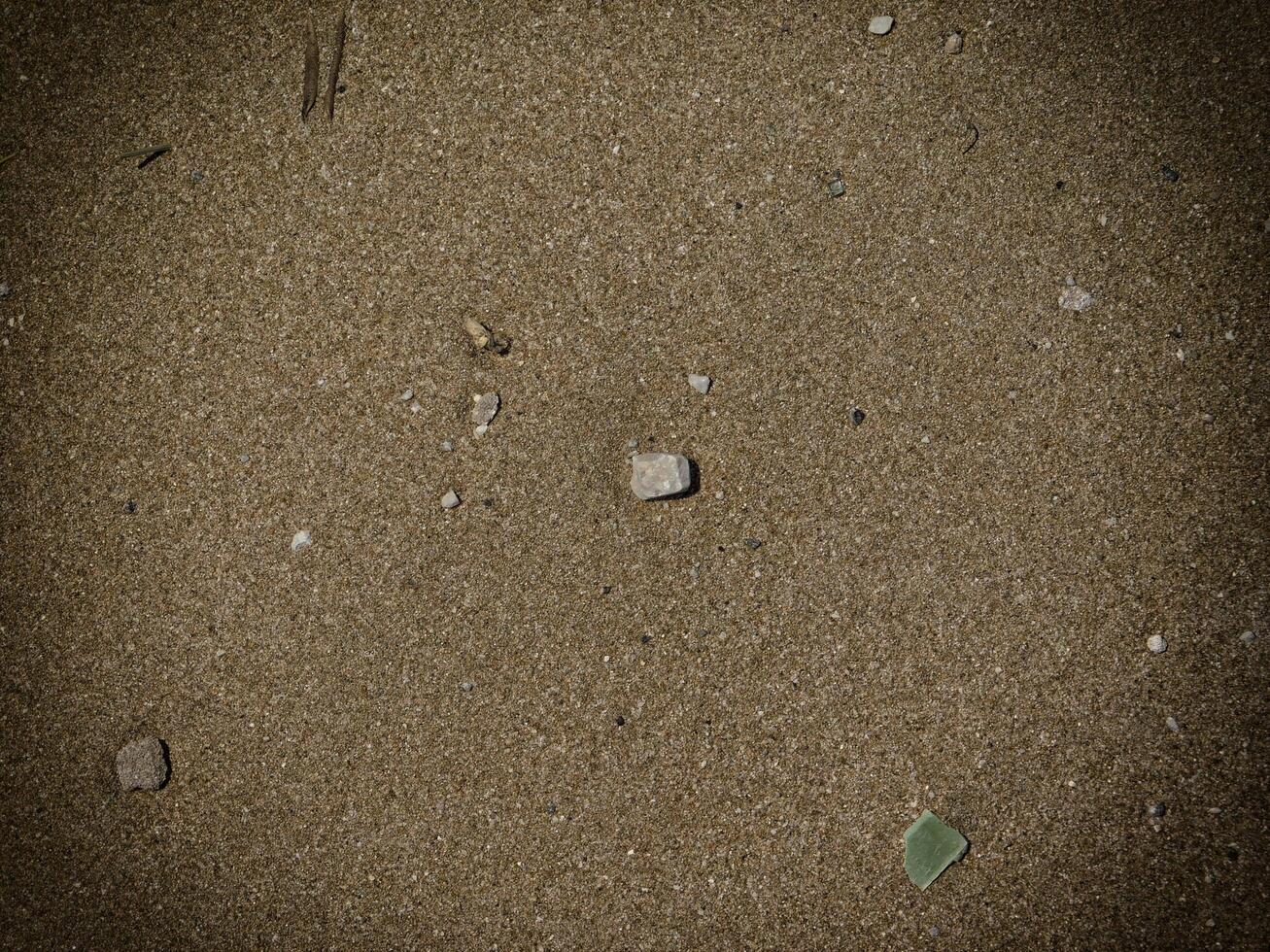 Texture Of Dark Sand At The Sea photo
